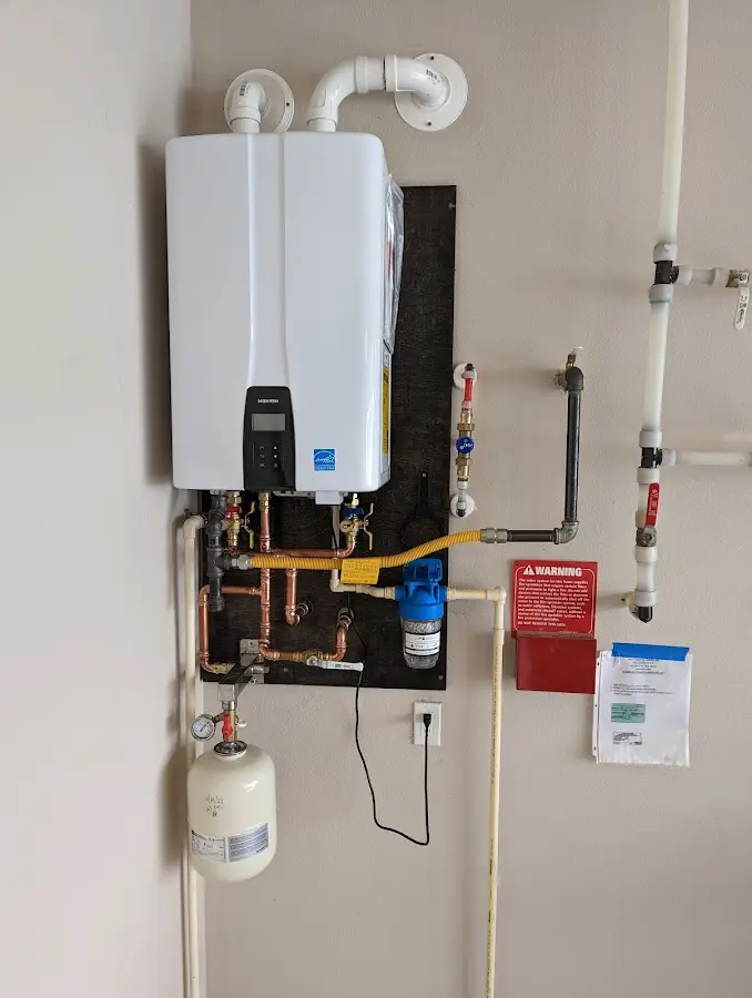 Professional plumber installing copper piping in a Orcutt home